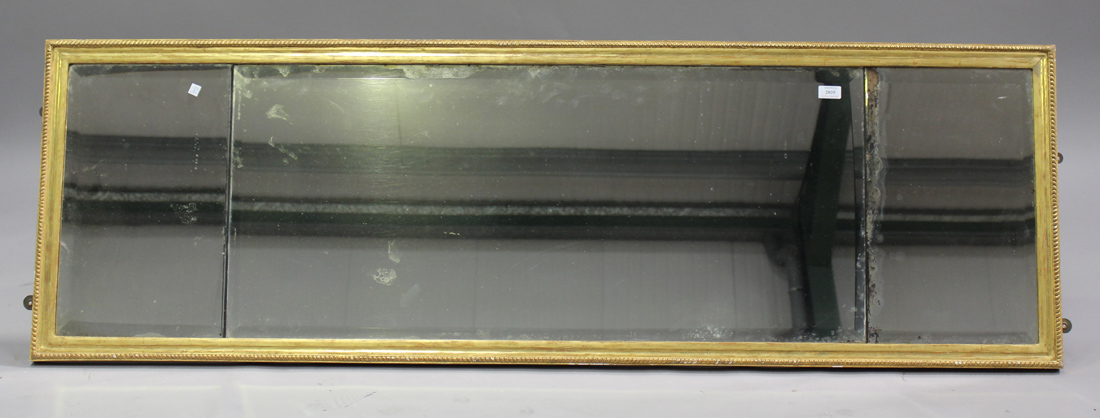 An early 20th century giltwood rectangular wall mirror, the bevelled three-section glass within a