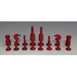 A late 19th century turned bone and red stained chess set, height of king 9cm. Buyer’s Premium 29.4%