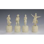 A set of four late 19th century European carved ivory figures of three musicians and a conductor,
