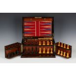 A Victorian burr walnut and ebony banded games compendium, the hinged lid and double-hinged front