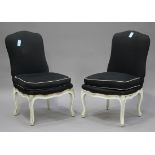 A pair of 20th century French Louis XV style white painted side chairs, the seats and backs