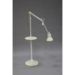 A mid-20th century cream painted anglepoise floor standing lamp, the stem with a circular tier and