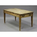 A late Victorian stripped pine kitchen table, the rectangular top above a drawer, raised on square