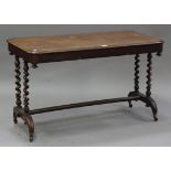 A Victorian mahogany centre table, the moulded top raised on barley twist legs united by a