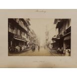 PHOTOGRAPHS. A mounted albumen-print photograph titled 'Bombay, Native Street', overall 30.5cm x