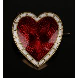 A gold and enamelled heart shaped brooch, the front with red guilloche enamelled decoration within a