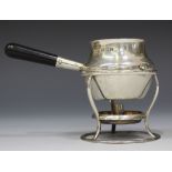 A George V silver brandy pan with ebonized turned wood handle, and wirework heater stand, Birmingham