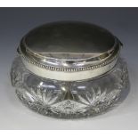 A German .800 silver mounted cut glass biscuit box of compressed circular form, the beaded hinged