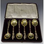 A harlequin set of six Dutch silver gilt serving spoons, each with an oval bowl, spiral twisted