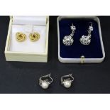A pair of white gold and colourless gem set pendant earrings, detailed '750', a pair of white gold