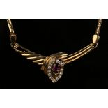 An Oriental gold, red and colourless gem set necklace, the front with an oval cluster motif, on a