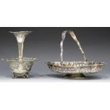 An Edwardian silver epergne, the central trumpet vase with pierced and embossed scroll rim, above