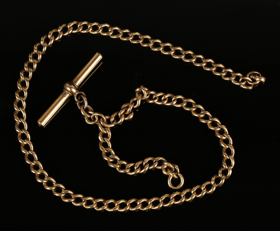An 18ct gold curblink watch Albert chain, fitted with an 18ct gold T-bar, length 38.5cm.Buyer’s