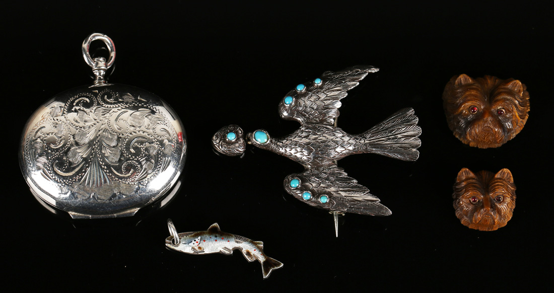 A silver and turquoise brooch in a St Esprit design, two carved tiger's eye terriers' faces with red