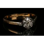 A gold, platinum and diamond set seven stone cluster ring, mounted with eight circular cut