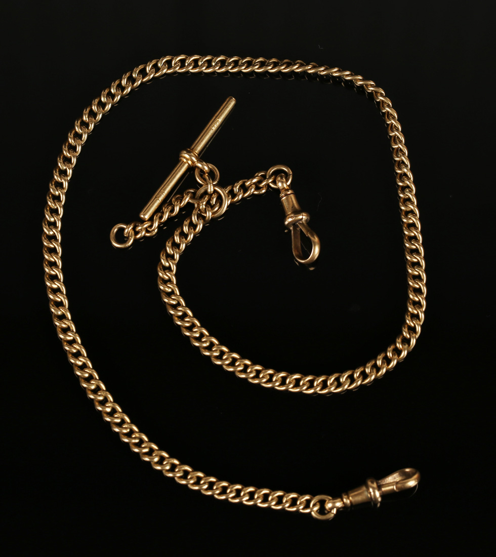 A gold curblink watch Albert chain, fitted with an 18ct gold T-bar and two 18ct gold swivels,