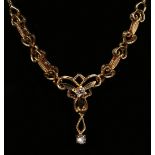 A gold and colourless gem set necklace, the front in a floral design, on an oval clasp, detailed '