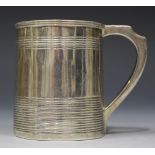 A George III silver christening tankard of cylindrical tapering form with engraved banding flanked