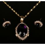 A gold mounted cabochon mauve and colourless gem set oval pendant, detailed '585', length 4cm,