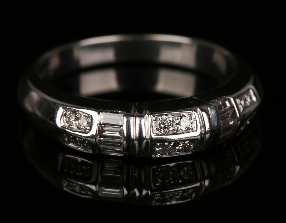 An 18ct white gold and diamond half-hoop ring, mounted with six pairs of circular cut diamonds