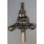 A sterling child's novelty rattle in the form of a seated cat with whistle terminal and mother-of-