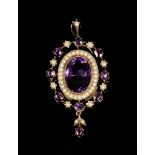 A gold, amethyst and seed pearl pendant brooch, mounted with the principal oval cut amethyst