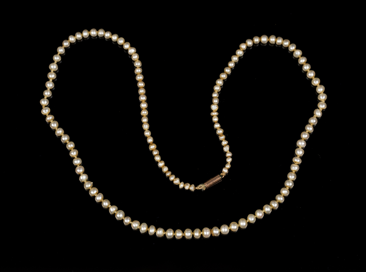 A single row necklace of one hundred and twenty-five graduated natural saltwater pearls on a