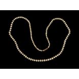 A single row necklace of one hundred and twenty-five graduated natural saltwater pearls on a