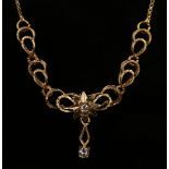 A gold and colourless gem set necklace, the front with a central star motif, on a box link chain
