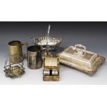 A collection of plated items, including a rectangular entrée dish, cover and handle with gadrooned