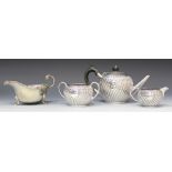 A Victorian silver bachelor's three-piece tea set of circular spiral reeded form, comprising teapot,