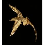 A gold brooch in the form of a bird of paradise with outspread wings, detailed '18ct', width 3cm,