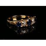 A gold, sapphire and diamond five stone ring, mounted with three cushion shaped sapphires