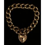 A 9ct gold solid curblink bracelet on a 9ct gold heart shaped padlock clasp.Buyer’s Premium 29.4% (