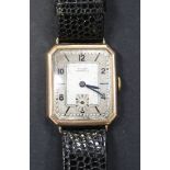 A Walker Unbreakable 9ct gold cut cornered rectangular gentleman's wristwatch, with a signed