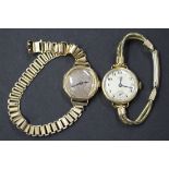 A 9ct gold circular cased lady's wristwatch, import mark Glasgow 1923, on a gold bar link bracelet