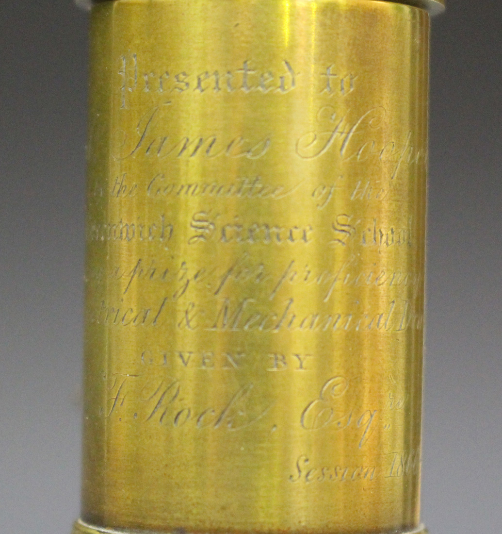 A mid-19th century brass monocular microscope with engraved presentation inscription, on a green - Image 3 of 5