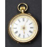 A 14ct gold cased keyless wind open-faced lady's fob watch, with a gilt jewelled cylinder