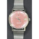 An Omega Seamaster De Ville steel circular cased gentleman's wristwatch, the signed dark pink dial