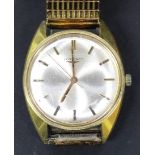 A Longines gilt metal fronted and steel backed gentleman's wristwatch, the signed silvered dial with