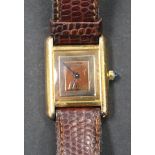 A Must de Cartier silver gilt rectangular cased quartz wristwatch, the three colour signed