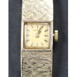 A Rotary 9ct gold lady's bracelet wristwatch, the signed square dial with baton numerals, on a