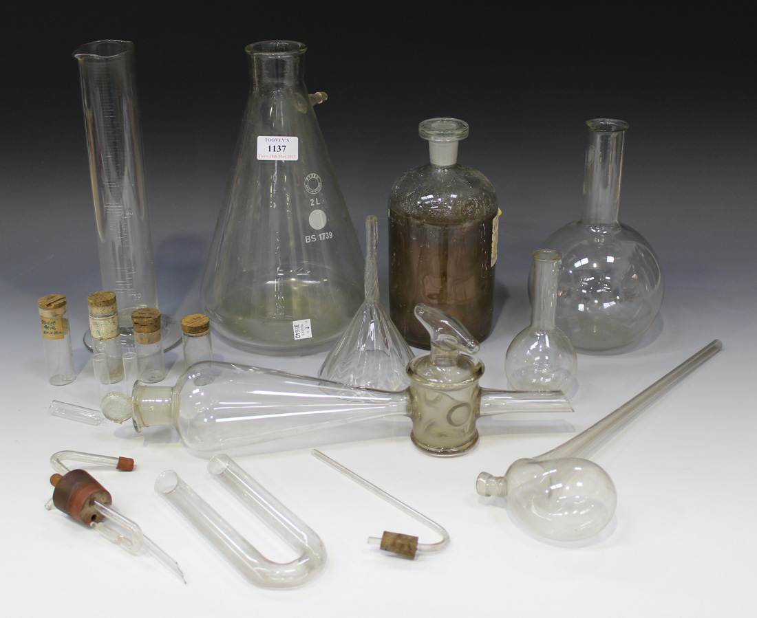 A collection of various glass chemistry and laboratory glassware, including distillation