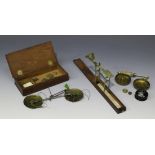 A George III mahogany cased brass guinea scales, applied paper label detailed 'A. Wilkinson ... late