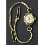 An Accurist 9ct gold circular cased lady's wristwatch on a 9ct gold Brazil link bracelet with a