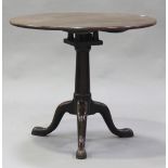 A George III mahogany circular tip-top wine table with bird cage mount, raised on a turned