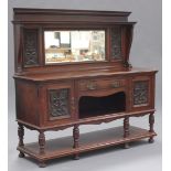 A late Victorian walnut mirror back sideboard with carved decoration by Maple & Co, fitted with a