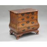 A mid-18th century Dutch bombé commode, the shaped top with projecting corners above four