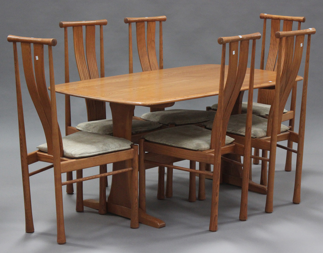 A late 20th century elm Ercol dining room suite, comprising a sideboard, height 74cm, length