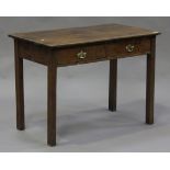A late 18th century oak side table, fitted with two short drawers, raised on block legs, height